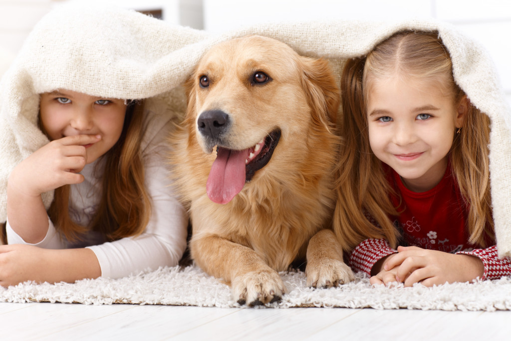 happy kids with their pet dog